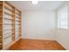 Office features built in bookshelves and wood floors at 235 Cocoanut Ave # 129E, Sarasota, FL 34236