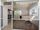Screened outdoor space features tile flooring, kitchenette and fire pit for entertaining with views of the city at 235 Cocoanut Ave # 129E, Sarasota, FL 34236