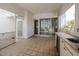 Outdoor patio area featuring tiled floor, a sink and bar refrigerator at 235 Cocoanut Ave # 129E, Sarasota, FL 34236