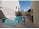 A community in-ground pool with lounge seating, a towel rack, and the depth marked as 5 feet at 235 Cocoanut Ave # 129E, Sarasota, FL 34236