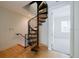 Unique spiral staircase leads to an upper level, offering distinctive architectural detail at 235 Cocoanut Ave # 129E, Sarasota, FL 34236