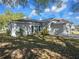 Single-story home with landscaped front yard, attached garage, and a welcoming entrance at 4601 Copper Ln, Plant City, FL 33566
