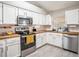 Bright kitchen with stainless steel appliances, butcher block counters, and white cabinets at 4601 Copper Ln, Plant City, FL 33566
