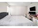 Main bedroom features a comfortable bed and a dedicated desk area for work or study at 4601 Copper Ln, Plant City, FL 33566