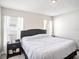 Bright main bedroom featuring a comfortable bed and a well-lit ambiance from the natural light at 4601 Copper Ln, Plant City, FL 33566