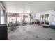 Covered screened patio area with room for entertaining and storage, including bikes and mowers at 4601 Copper Ln, Plant City, FL 33566