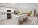 Bright kitchen featuring white cabinetry, stainless steel appliances, and an island with bar seating at 25298 Jubal St, Punta Gorda, FL 33955