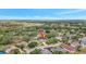 Desirable neighborhood with mature landscaping and a golf course in the background at 11019 Pine Lilly Pl, Lakewood Ranch, FL 34202