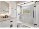 Modern bathroom with glass-enclosed shower, stylish tile, and sleek vanity offers a spa-like experience at 11019 Pine Lilly Pl, Lakewood Ranch, FL 34202