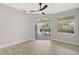 Spacious bedroom with sliding glass doors to the pool and ceiling fan at 11019 Pine Lilly Pl, Lakewood Ranch, FL 34202