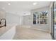 Open living room and dining area with lots of natural light and sliding glass door to the patio at 11019 Pine Lilly Pl, Lakewood Ranch, FL 34202