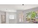 Bright living area with large windows, modern lighting, and neutral walls and flooring at 11019 Pine Lilly Pl, Lakewood Ranch, FL 34202