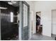 Modern bathroom featuring a tiled shower with glass block accents at 11120 5Th E St, Treasure Island, FL 33706