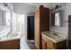 Bathroom with double vanity sinks and walk-in shower at 11120 5Th E St, Treasure Island, FL 33706