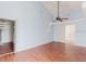 Bright bedroom featuring wood floors, walk-in closet, and ceiling fan at 11120 5Th E St, Treasure Island, FL 33706