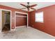 Bedroom featuring a window, ceiling fan and closet at 11120 5Th E St, Treasure Island, FL 33706