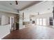 Large living room with tiled floors, fireplace, built-in shelves, and backyard access at 11120 5Th E St, Treasure Island, FL 33706