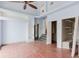 Open living room with hardwood floors, ceiling fan, and high ceilings at 11120 5Th E St, Treasure Island, FL 33706