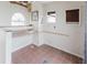Features a built-in desk, tile flooring, and natural light from an arched window at 11120 5Th E St, Treasure Island, FL 33706