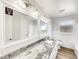 Spacious bathroom featuring granite counters, dual sinks, and modern fixtures at 1115 31St W St, Bradenton, FL 34205