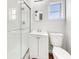 Clean, renovated bathroom with a glass-enclosed shower and a white vanity at 1115 31St W St, Bradenton, FL 34205