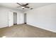 Bright bedroom featuring neutral carpet, ceiling fan and a closet at 1115 31St W St, Bradenton, FL 34205
