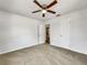 Spacious bedroom features neutral carpet, ceiling fan, and ample closet space at 1115 31St W St, Bradenton, FL 34205