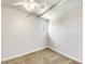 Minimalist bedroom with neutral carpet, ceiling fan, and a small window at 1115 31St W St, Bradenton, FL 34205