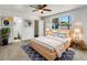 Cozy bedroom with natural light, featuring an accent rug, ensuite bathroom, and closet at 1115 31St W St, Bradenton, FL 34205