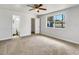 Bright, airy bedroom with a large window, neutral carpet and access to an ensuite bathroom and closet at 1115 31St W St, Bradenton, FL 34205