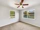 Bright bedroom featuring neutral carpet, white walls and large windows at 1115 31St W St, Bradenton, FL 34205