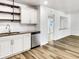 Modern kitchen featuring granite counters, stainless steel appliances, and open shelving at 1115 31St W St, Bradenton, FL 34205