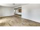 Open-concept living room with hardwood-style floors and access to kitchen at 1115 31St W St, Bradenton, FL 34205