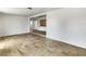 Open-concept living room with hardwood-style floors and access to kitchen at 1115 31St W St, Bradenton, FL 34205