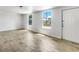 Bright living room with tile floors, large windows, and fresh white paint at 1115 31St W St, Bradenton, FL 34205