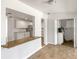 Open-concept space with views of the kitchen, hardwood floors, and lots of natural light at 1115 31St W St, Bradenton, FL 34205