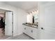 Bright bathroom featuring double sinks with granite counters and modern fixtures at 13532 Palmera Vista Dr, Riverview, FL 33579