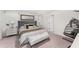 Serene bedroom featuring a tufted headboard, stylish decor, and a cozy hanging chair, perfect for relaxation at 13532 Palmera Vista Dr, Riverview, FL 33579