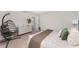 Bright bedroom with a comfortable bed, stylish decor, and a cozy hanging chair at 13532 Palmera Vista Dr, Riverview, FL 33579