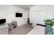 Bright bedroom with a comfortable daybed, stylish decor, and a functional workspace at 13532 Palmera Vista Dr, Riverview, FL 33579