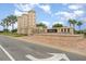 Elegant community entrance with brick architecture, lush landscaping, and prominent signage, creating a welcoming ambiance at 13532 Palmera Vista Dr, Riverview, FL 33579