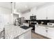 Modern kitchen features granite countertops, stainless steel appliances, and a breakfast bar at 13532 Palmera Vista Dr, Riverview, FL 33579