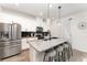 Modern kitchen features granite countertops, stainless steel appliances, and a breakfast bar at 13532 Palmera Vista Dr, Riverview, FL 33579