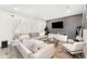 Spacious living room boasts a comfortable sectional sofa, stylish decor, and plenty of seating at 13532 Palmera Vista Dr, Riverview, FL 33579