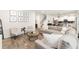 Open-concept living room features contemporary furnishings, stylish decor, and plenty of natural light at 13532 Palmera Vista Dr, Riverview, FL 33579