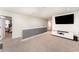 Spacious loft area with a media console, perfect for entertainment and relaxation at 13532 Palmera Vista Dr, Riverview, FL 33579