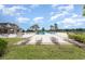 Resort-style pool area with comfortable lounge chairs, palm trees, and picturesque views of the community landscape at 13532 Palmera Vista Dr, Riverview, FL 33579