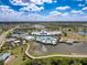 Community clubhouse with pool, lake, and beautiful grounds, with plenty of amenities and a resort-like feel at 18743 Coastal Shore Ter, Land O Lakes, FL 34638
