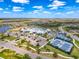 Aerial view of the community pool, tennis courts and clubhouse. This is resort style living! at 18743 Coastal Shore Ter, Land O Lakes, FL 34638
