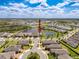 Stunning aerial view of a waterfront property nestled within a vibrant community featuring beautiful landscaping at 18743 Coastal Shore Ter, Land O Lakes, FL 34638